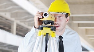Contractor Services: Image of surveyor inside a concrete structure