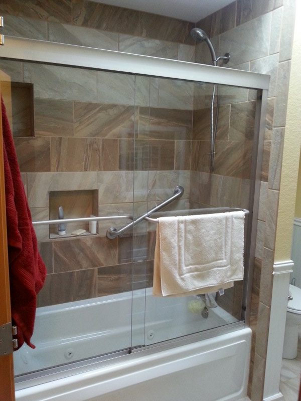 A Colorado Springs bathroom remodel with new shower door, fixtures, and tiles